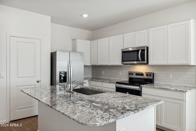 25484 W Graham Trl, Buckeye, AZ 85326 - kitchen with appliances with stainless steel finishes, a sink, white cabinetry, tasteful backsplash, and recessed lighting