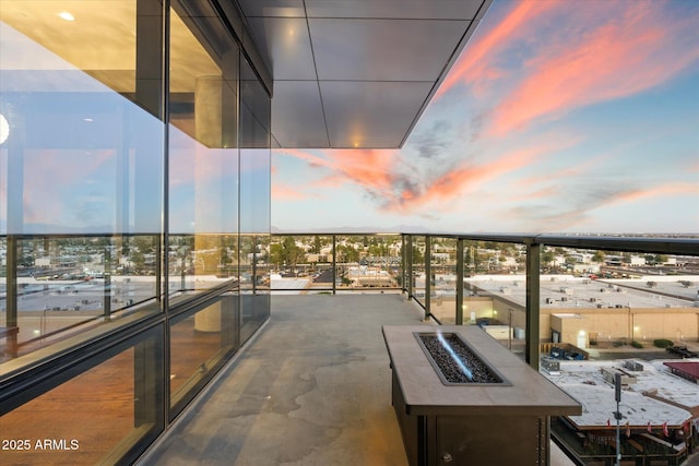 balcony at dusk with a fire pit