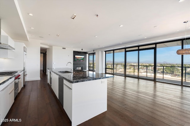 kitchen featuring stainless steel appliances, modern cabinets, and a sink