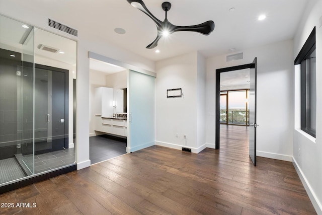 unfurnished bedroom with dark wood-type flooring, recessed lighting, visible vents, and baseboards