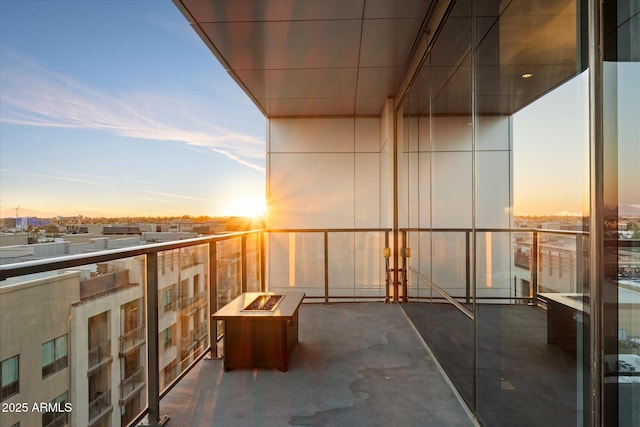 balcony at dusk with an outdoor fire pit