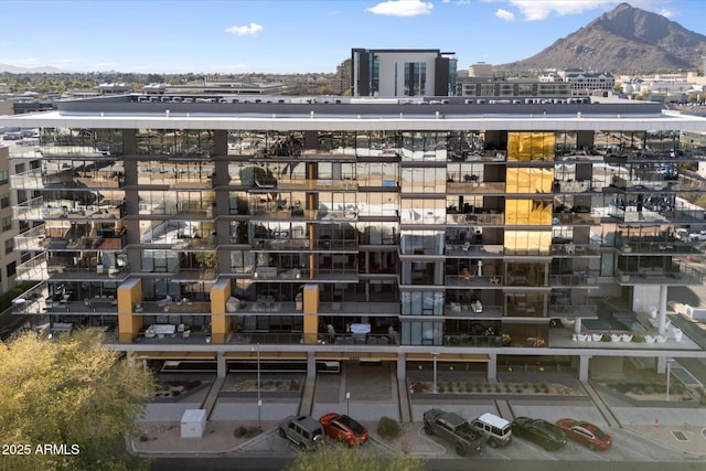 exterior space with a mountain view and a city view