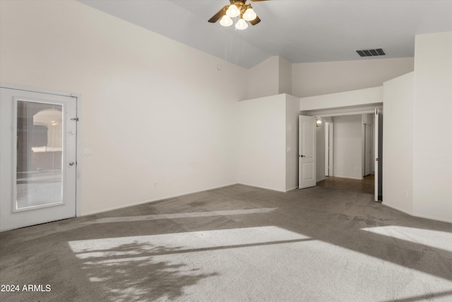 empty room featuring ceiling fan, carpet, and lofted ceiling