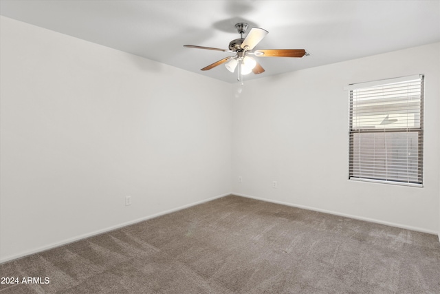 unfurnished room with ceiling fan and carpet floors