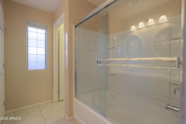 bathroom with tile patterned floors and enclosed tub / shower combo