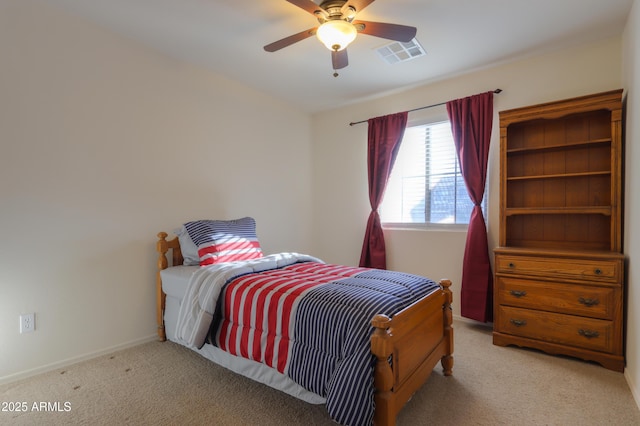 bedroom featuring ceiling fan and light carpet