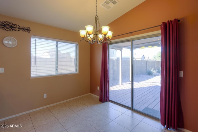 unfurnished room with a notable chandelier, tile patterned flooring, and vaulted ceiling