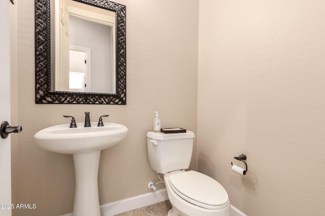 5226 S Fairchild Ln, Chandler, AZ 85249 - bathroom featuring baseboards and toilet