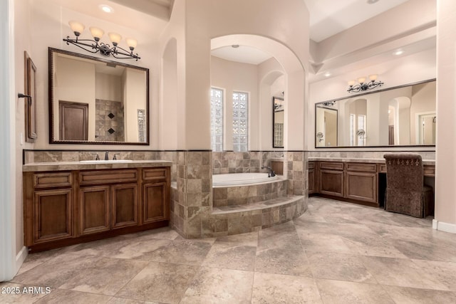 5226 S Fairchild Ln, Chandler, AZ 85249 - full bath featuring a bath, two vanities, tiled shower, and a chandelier
