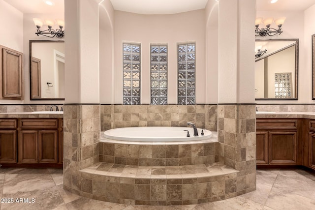 5226 S Fairchild Ln, Chandler, AZ 85249 - full bath featuring a bath, two vanities, tile walls, and wainscoting