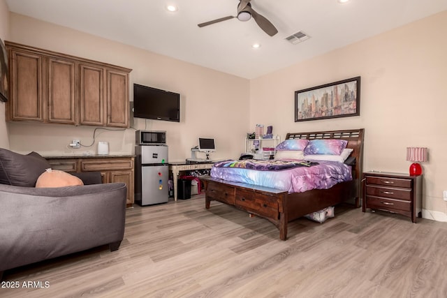 5226 S Fairchild Ln, Chandler, AZ 85249 - bedroom featuring freestanding refrigerator, light wood-style floors, recessed lighting, and ceiling fan