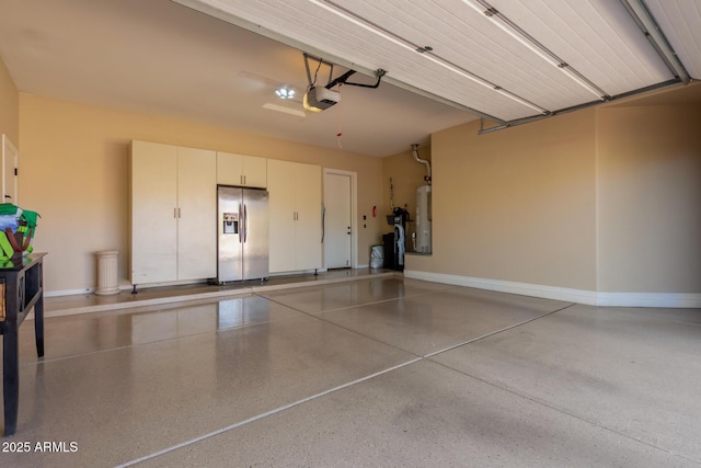 5226 S Fairchild Ln, Chandler, AZ 85249 - garage with stainless steel refrigerator with ice dispenser, water heater, a garage door opener, and baseboards