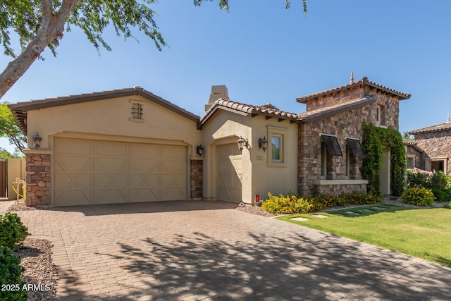 5226 S Fairchild Ln, Chandler, AZ 85249 - mediterranean / spanish-style home featuring stone siding, stucco siding, a garage, and a tiled roof