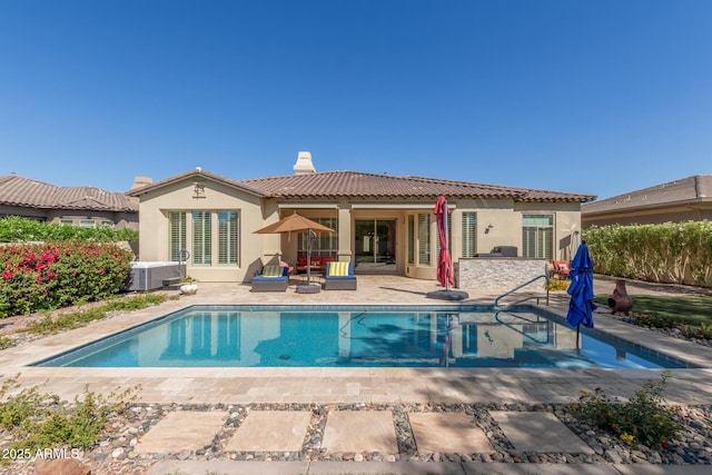 5226 S Fairchild Ln, Chandler, AZ 85249 - rear view of property with a patio, a tile roof, stucco siding, and a chimney