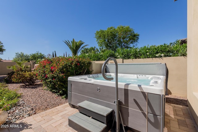 5226 S Fairchild Ln, Chandler, AZ 85249 - view of patio / terrace with a hot tub and fence