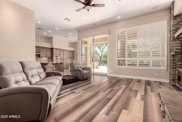 5226 S Fairchild Ln, Chandler, AZ 85249 - living room with a ceiling fan, wood finished floors, recessed lighting, and baseboards
