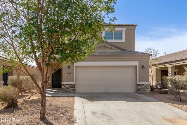 view of front of house with a garage, stone siding, concrete driveway, and stucco siding