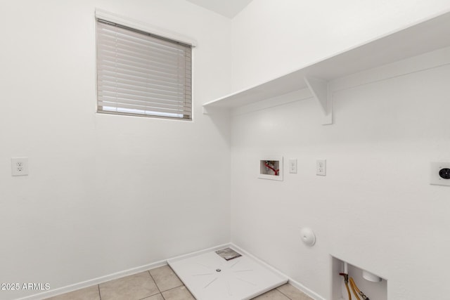 washroom featuring laundry area, baseboards, hookup for an electric dryer, washer hookup, and light tile patterned flooring