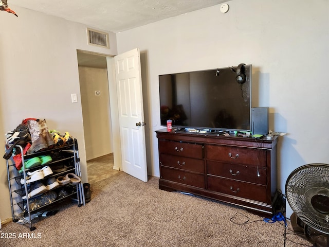 carpeted bedroom with visible vents