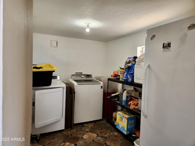 washroom featuring laundry area and separate washer and dryer