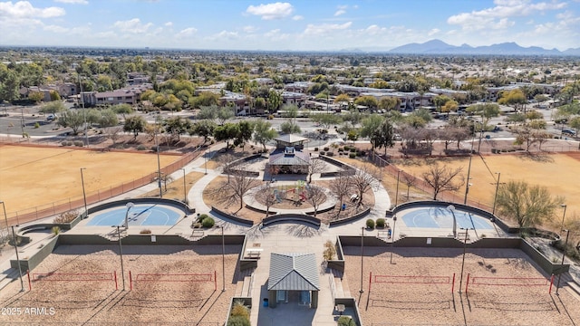 birds eye view of property with a mountain view