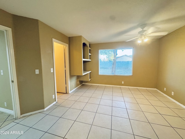 interior space featuring ceiling fan and light tile patterned floors