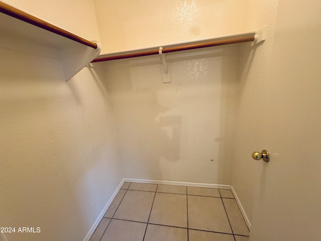 walk in closet featuring light tile patterned floors