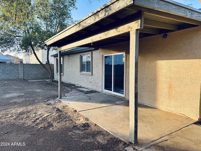 back of property with a patio area