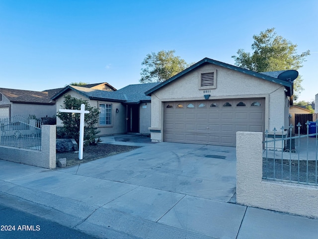 ranch-style house featuring a garage