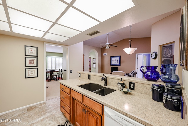 kitchen featuring ceiling fan, lofted ceiling, hanging light fixtures, sink, and dishwasher