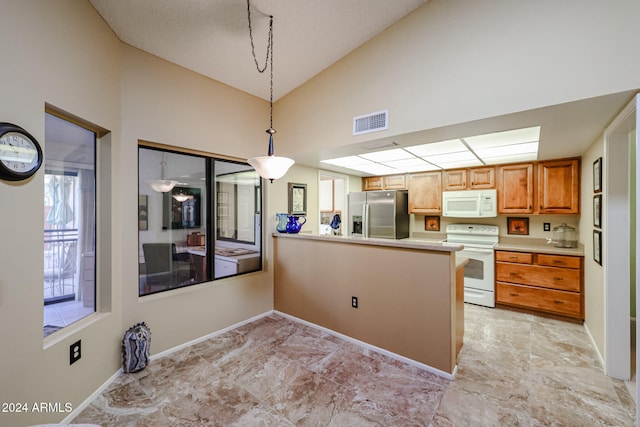 kitchen featuring white appliances, hanging light fixtures, high vaulted ceiling, and kitchen peninsula