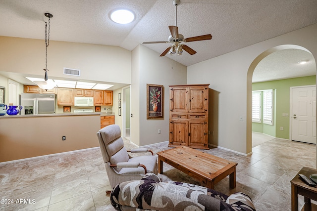 living room featuring high vaulted ceiling, a textured ceiling, and ceiling fan