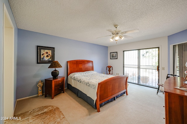 bedroom with access to exterior, ceiling fan, light carpet, and a textured ceiling