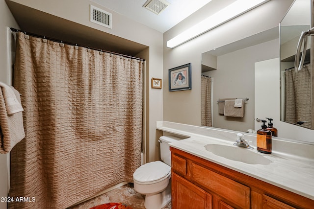 bathroom with vanity, toilet, and a shower with shower curtain