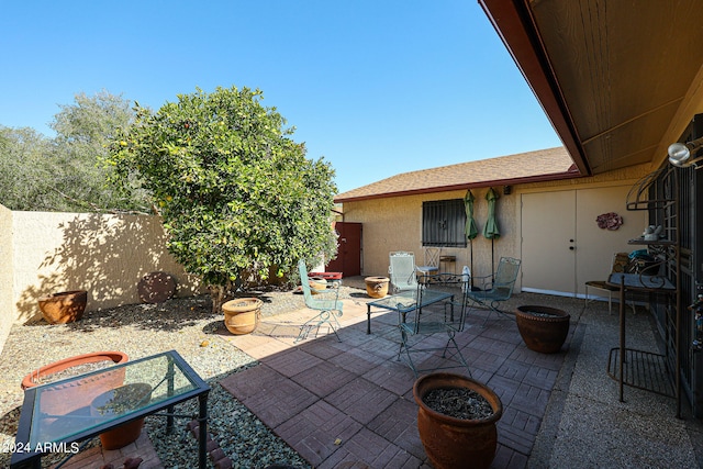 view of patio / terrace featuring a fire pit