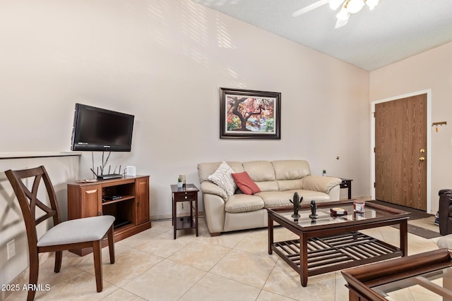 living room featuring light tile patterned floors and ceiling fan