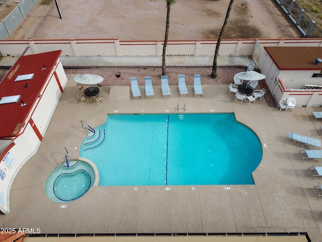 community pool featuring a lanai and a patio