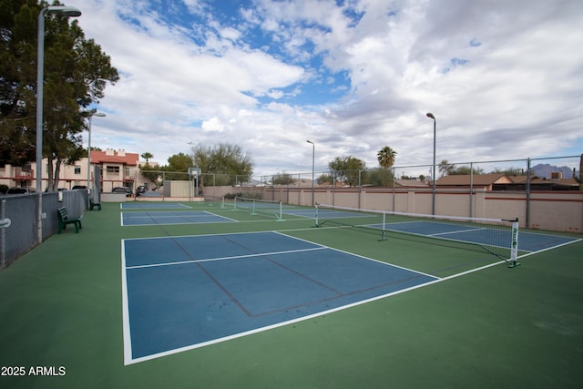 view of sport court with fence