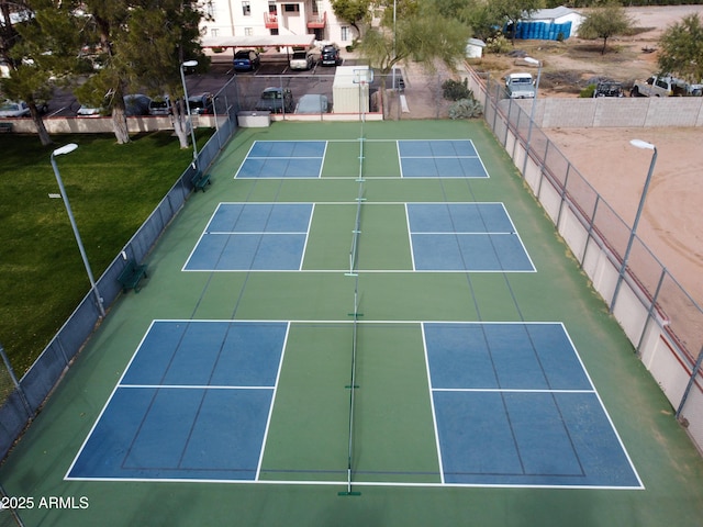 view of sport court with fence