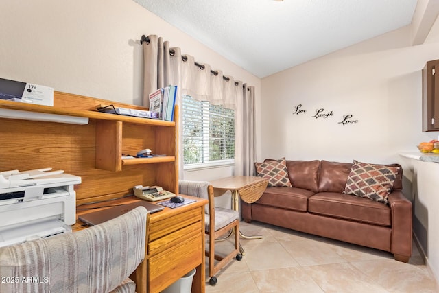 living area featuring lofted ceiling, light tile patterned floors, and a textured ceiling