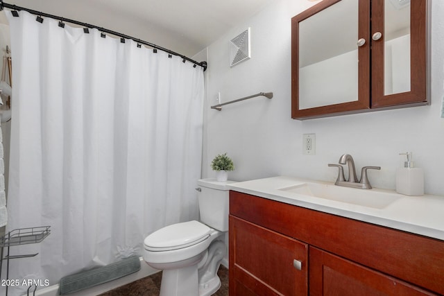 bathroom featuring vanity, toilet, and curtained shower