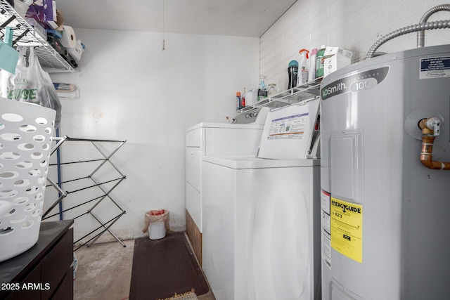 laundry area with washer and clothes dryer and water heater