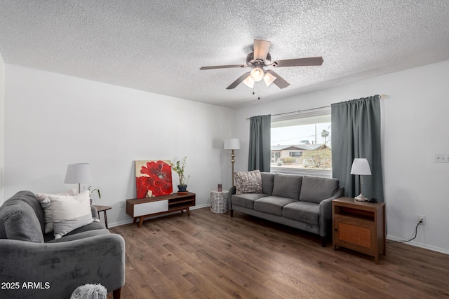 living room with a textured ceiling, dark hardwood / wood-style floors, and ceiling fan