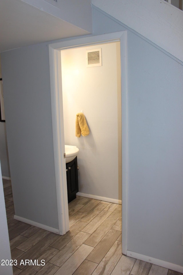 7120 E Wilshire Dr Unit 10, Scottsdale, AZ 85257 - hall with light wood-type flooring and baseboards