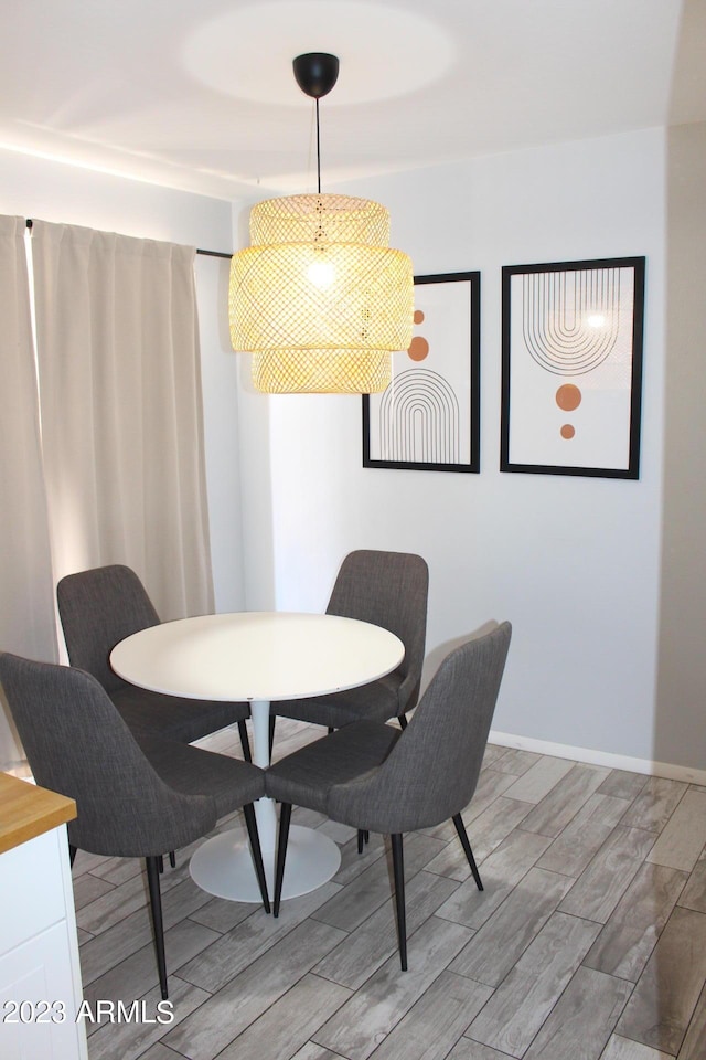 7120 E Wilshire Dr Unit 10, Scottsdale, AZ 85257 - dining space with wood tiled floors and baseboards
