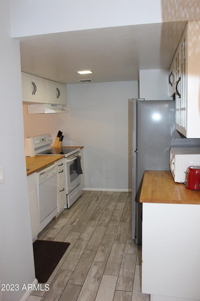 7120 E Wilshire Dr Unit 10, Scottsdale, AZ 85257 - kitchen with white appliances, butcher block counters, light wood finished floors, and under cabinet range hood