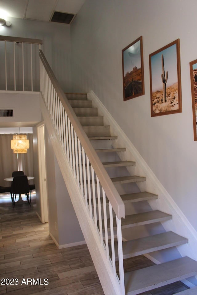 7120 E Wilshire Dr Unit 10, Scottsdale, AZ 85257 - stairs with wood finished floors and baseboards