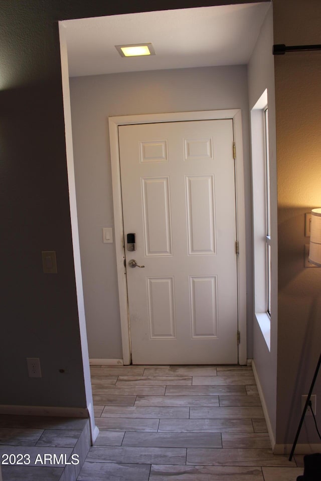 7120 E Wilshire Dr Unit 10, Scottsdale, AZ 85257 - entryway featuring wood tiled floors and baseboards