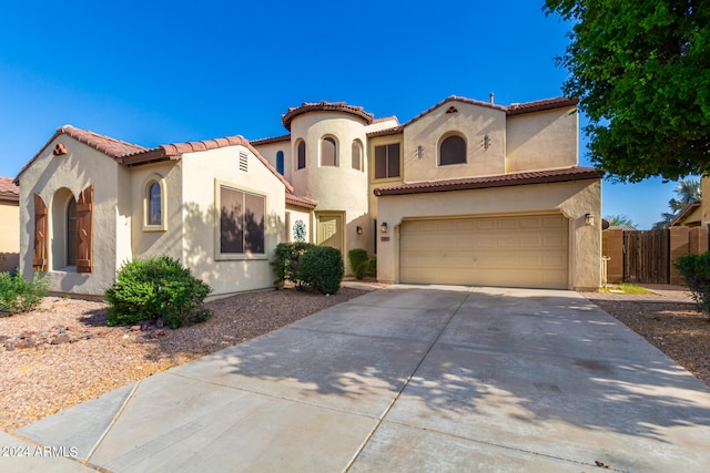 mediterranean / spanish-style home featuring a garage