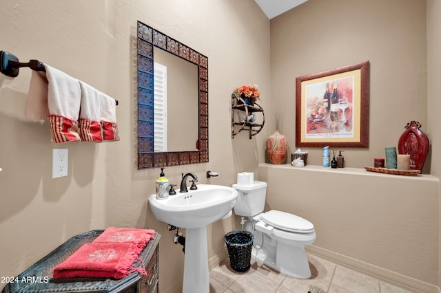 bathroom with tile patterned floors and toilet